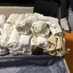 Arrestan colombiana en el AILA con 49 prendas impregnadas de presunta cocaína