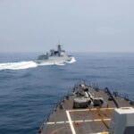 China envía fuerzas para vigilar un buque de guerra de EEUU